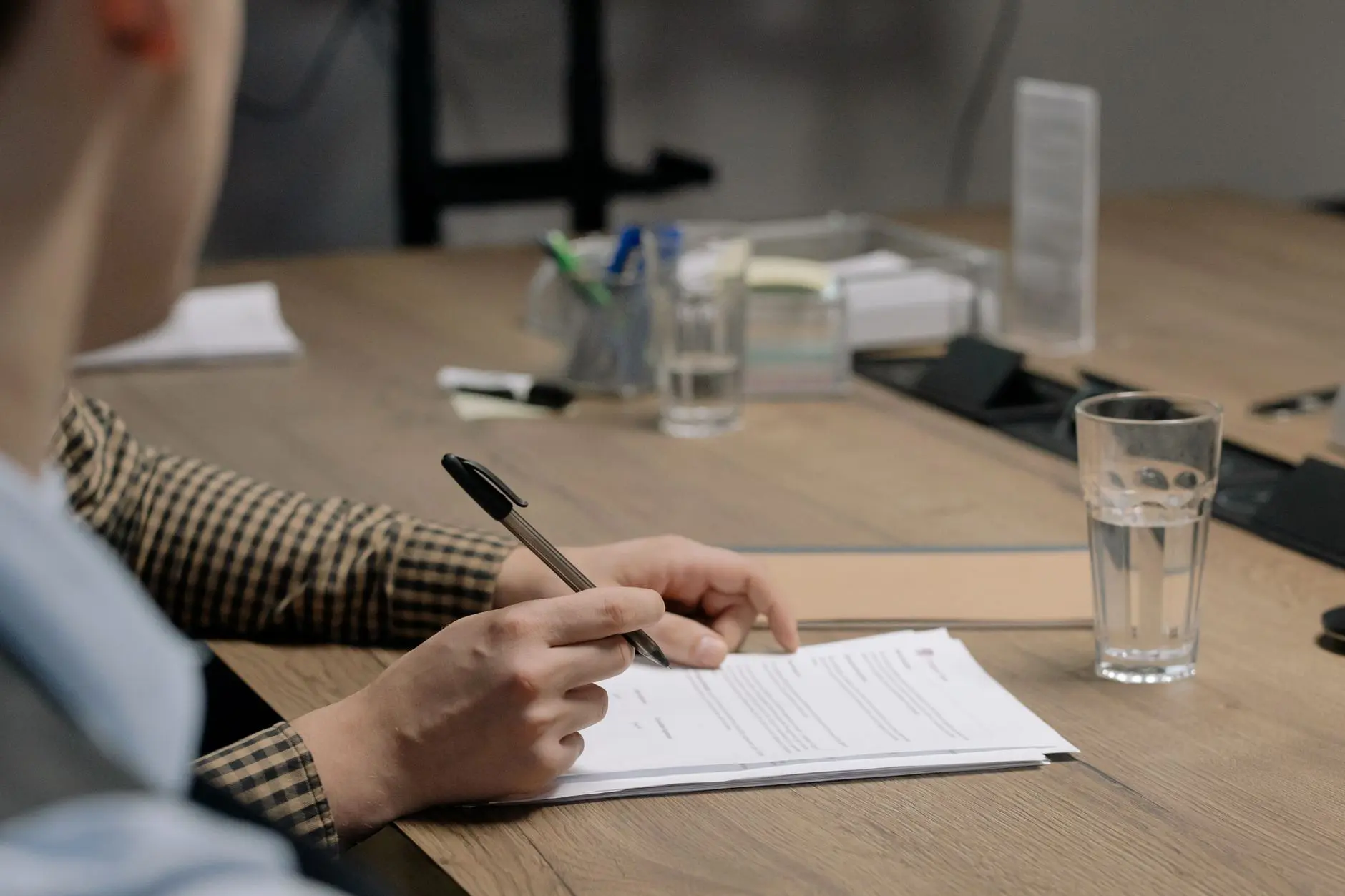 Supported housing needs assessment records being reviewed at an office desk