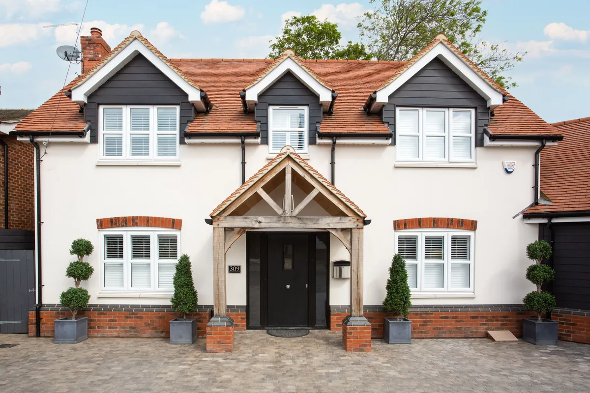 A well-maintained two-storey UK home with a tidy front garden