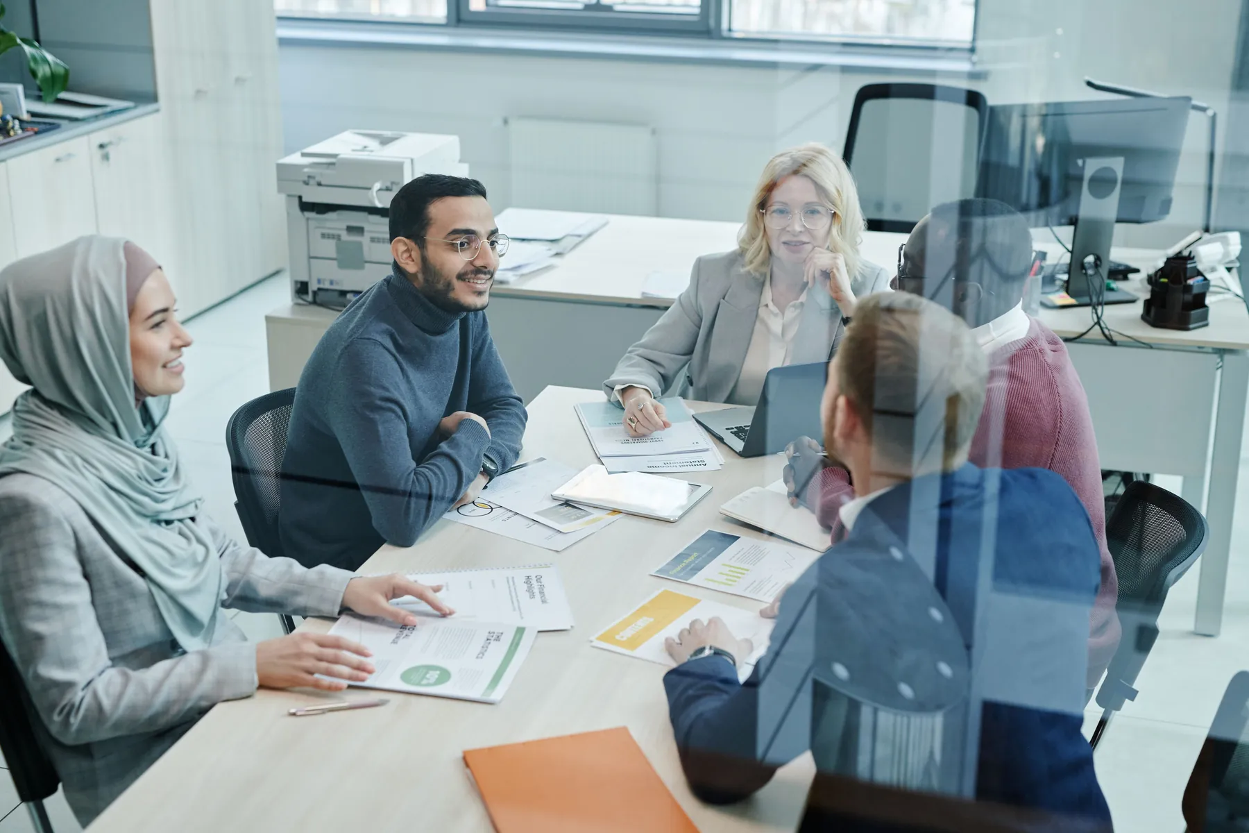 A diverse group of professionals in a partnership meeting