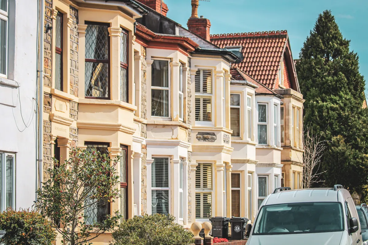 A row of well-maintained UK terraced houses